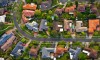 street photo looking down on road and houses